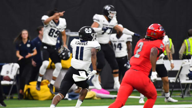 Oct 16, 2021; Paradise, Nevada, USA; Utah State Aggies wide receiver Savon Scarver (11) returns a kick for a touchdown during the first half against the UNLV Rebels at Allegiant Stadium. Mandatory Credit: Stephen R. Sylvanie-USA TODAY Sports